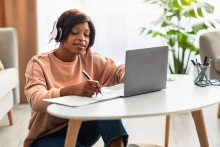 Student using a laptop at a table